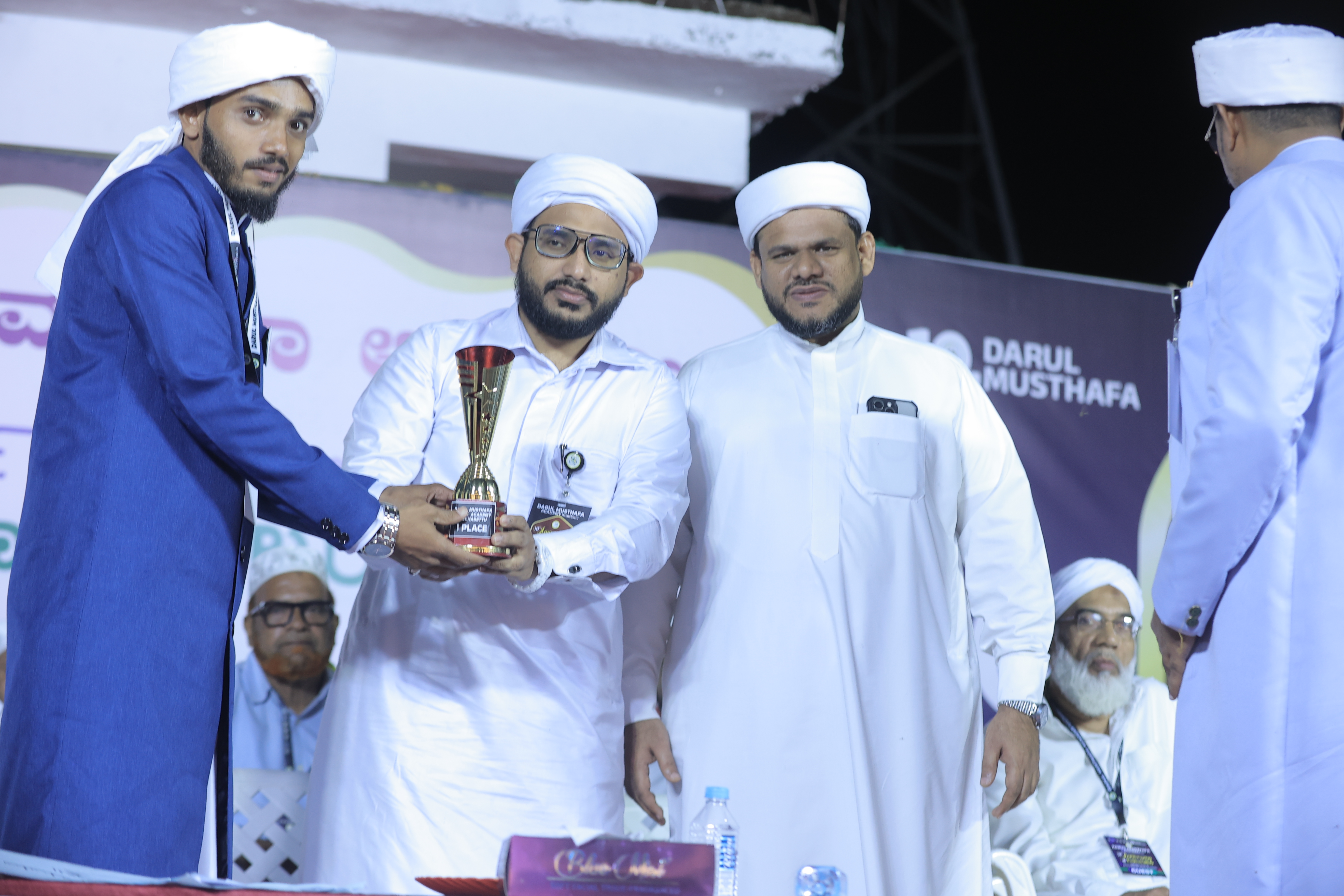 Full group of graduates on stage